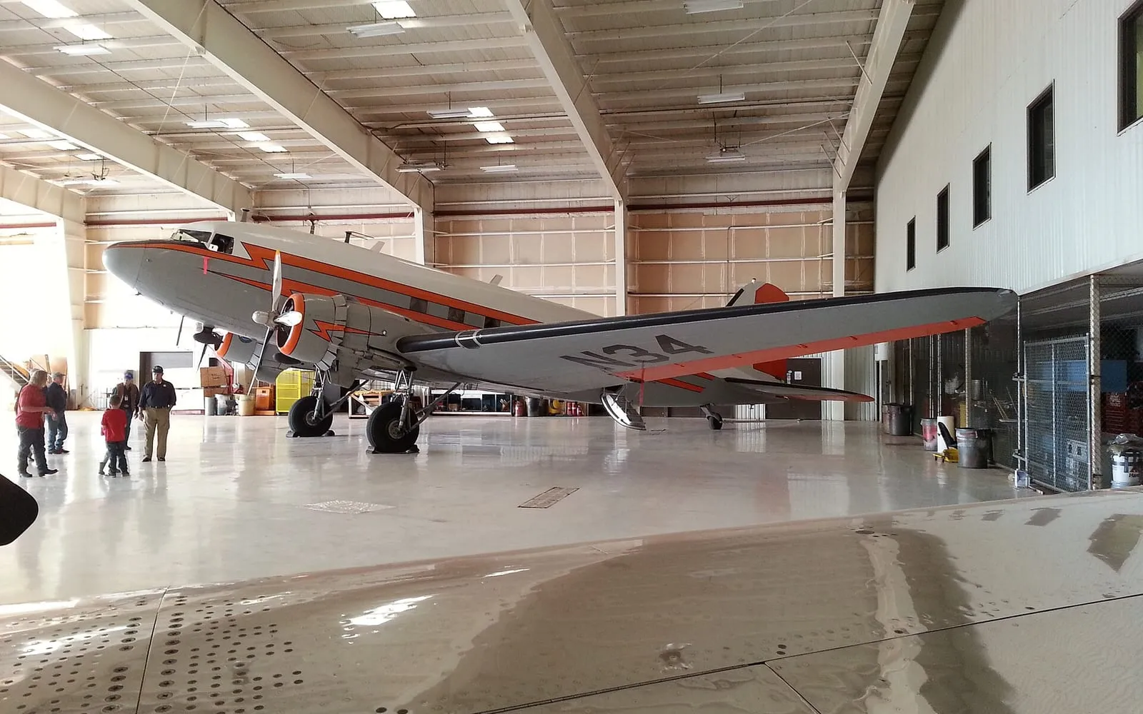 A vintage DC-3 airliner inside the Texas Air & Space Museum hangar