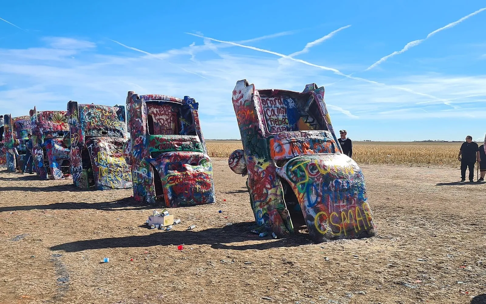 The painted Cadillacs of Cadillac Ranch standing nose-down in the field