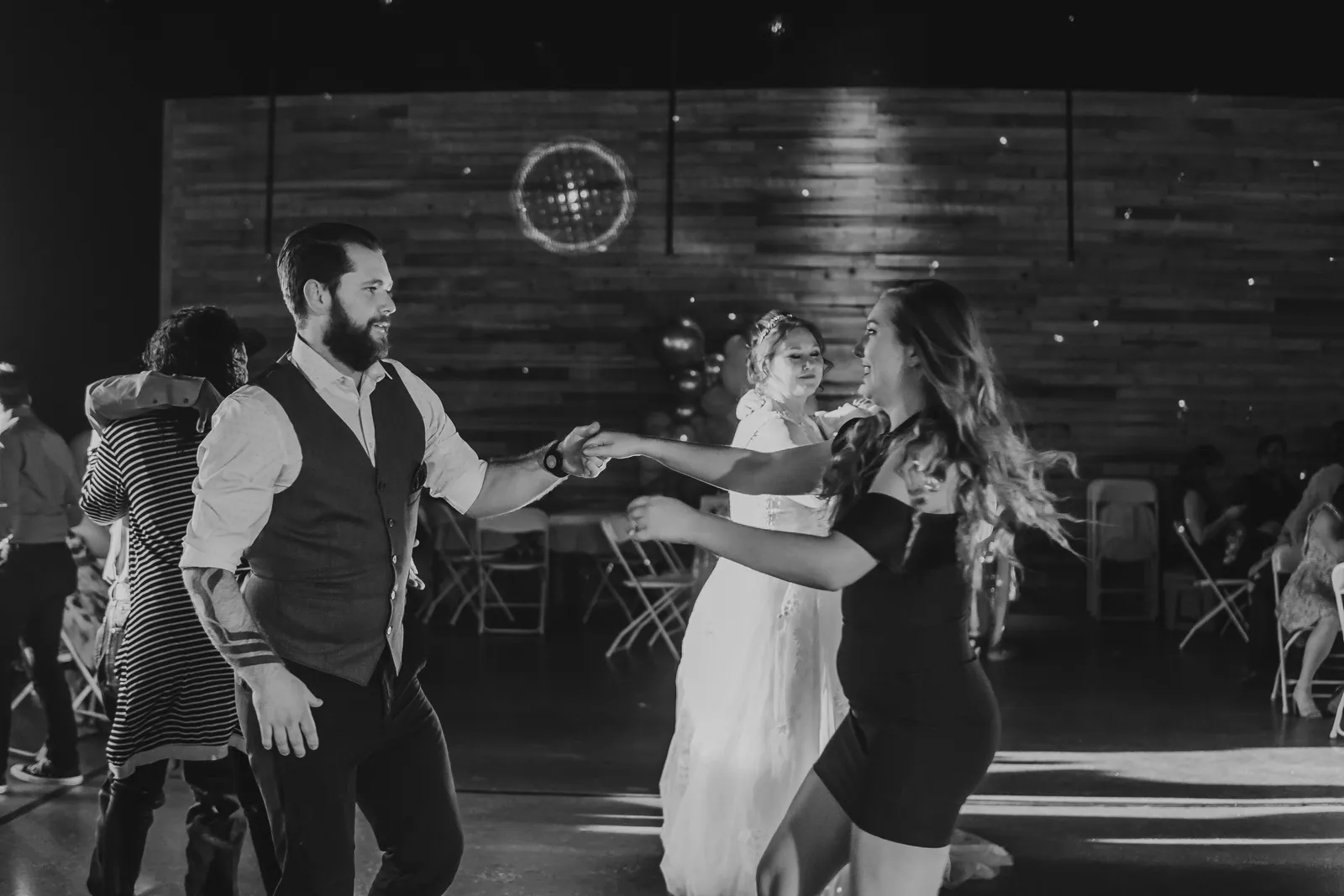 Wedding guests dancing under the disco ball