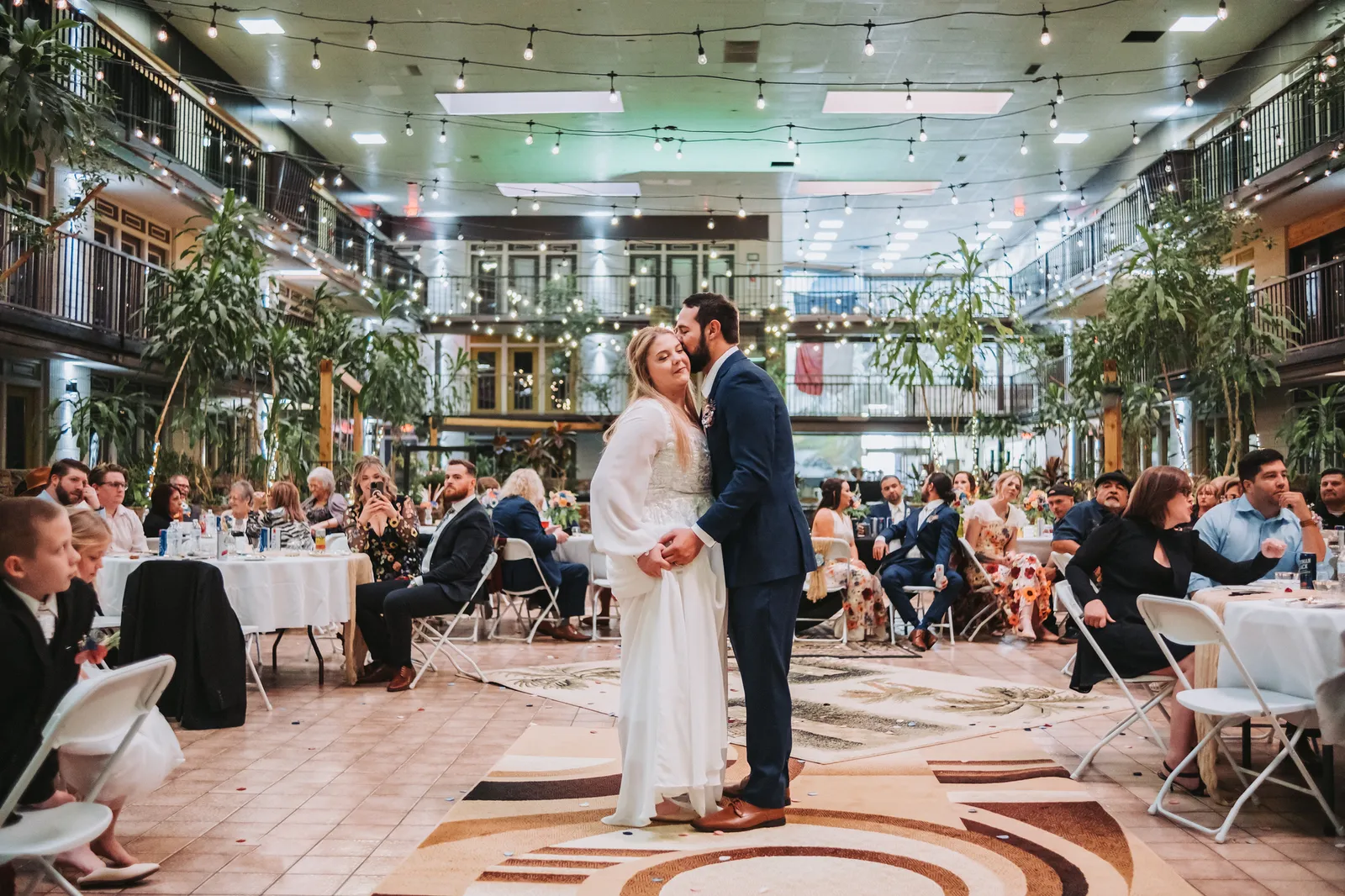A couple shares their first dance in the Cactus Cove atrium