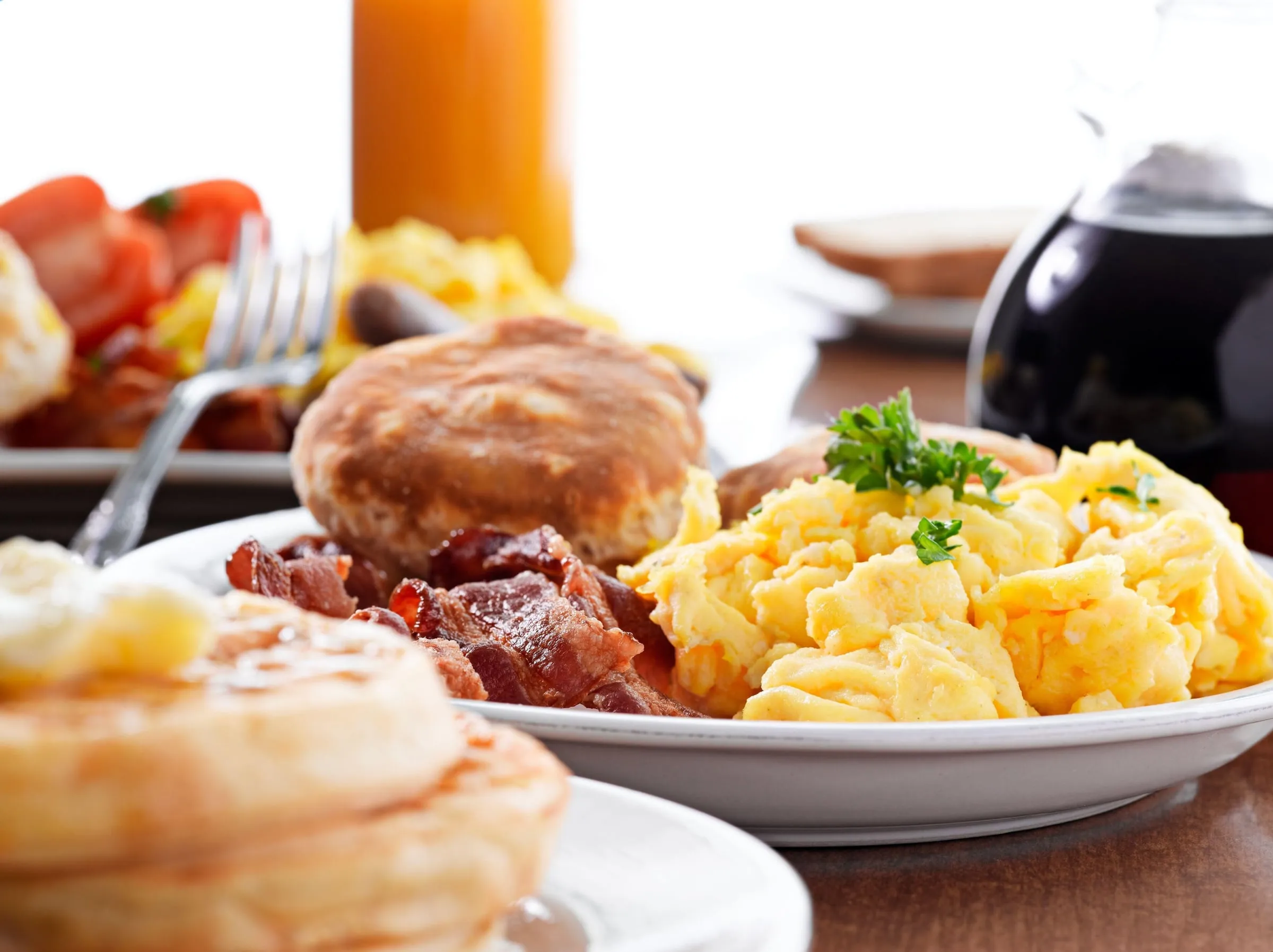 The hot breakfast spread: waffles, eggs, bacon and coffee