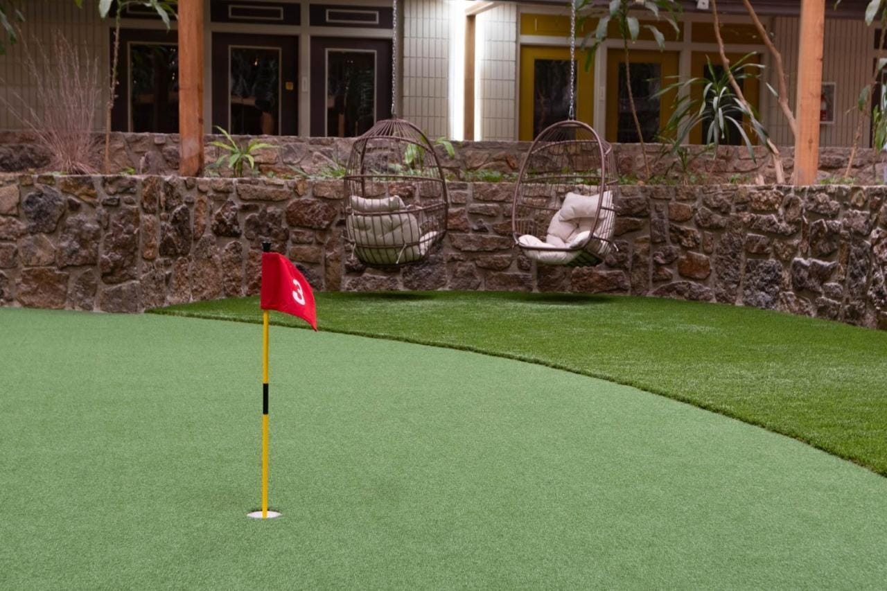 The putting green with its red flag